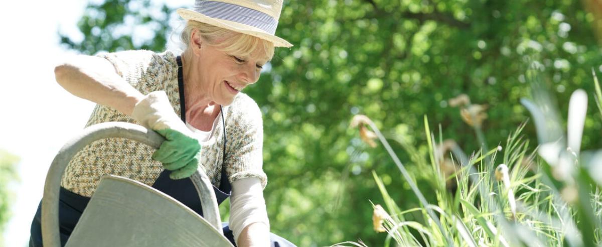 older lady watering her plants